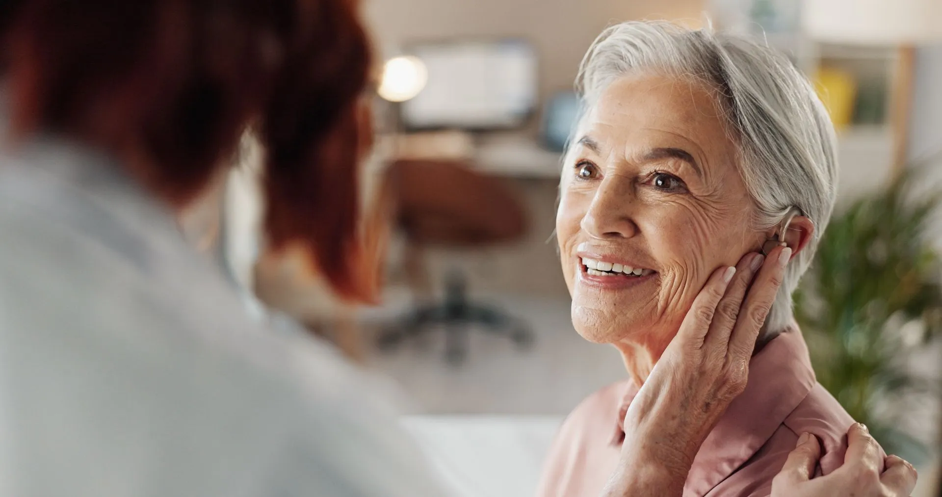 A Virsono clinician with a patient during a hearing consultation